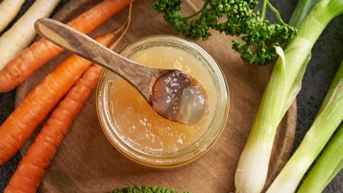 A bowl of congealed bone broth containing gelatin, which may help ease inflammation in the gut 